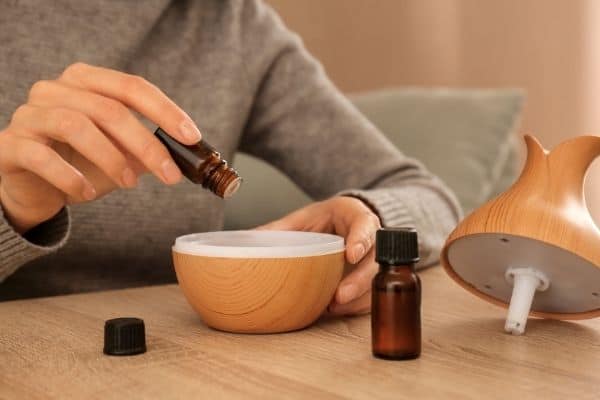 Person Setting Up Essential Oil Diffuser