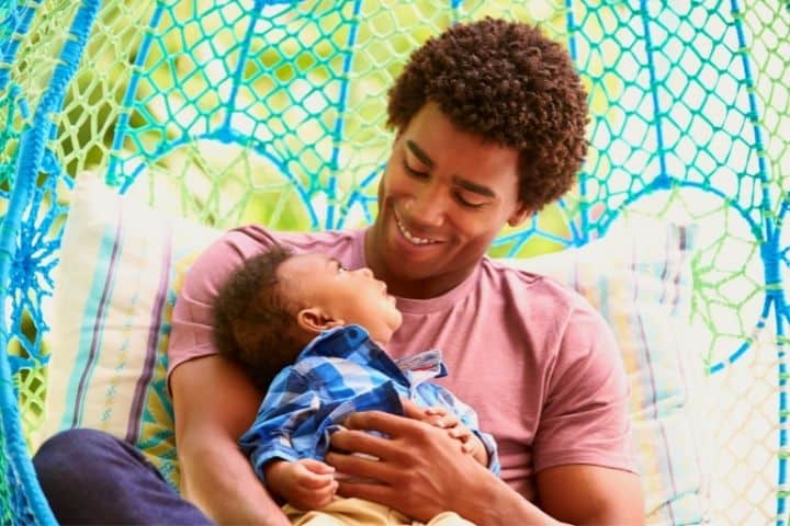 A Father Smiles At His Baby