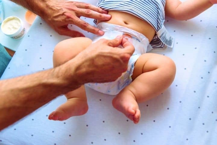 A Man Changes His Babys Diaper
