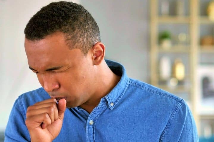A Man Coughs