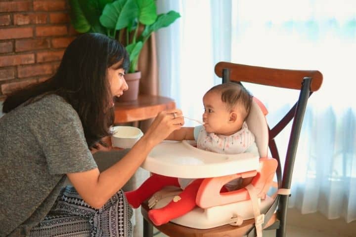 Mom Is Feeding Her Baby With Vegemite