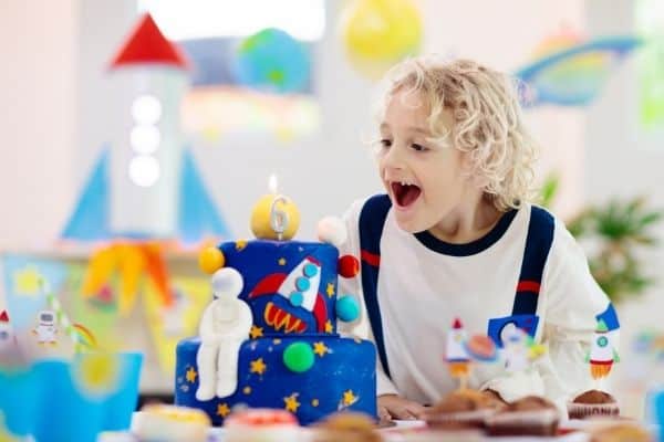 Young Boy Happy With Birthday Theme