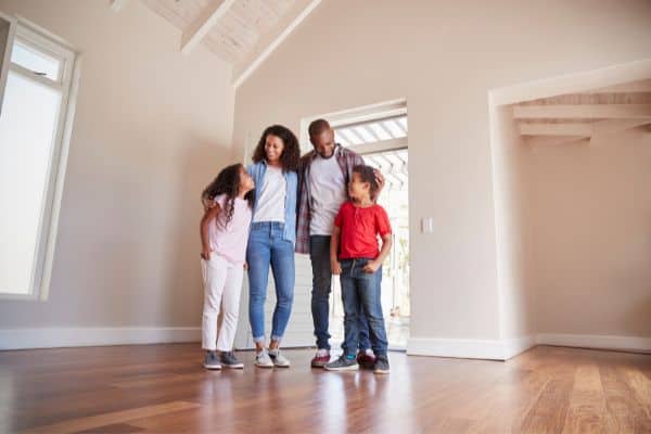 Happy Family In Newly Renovated Home