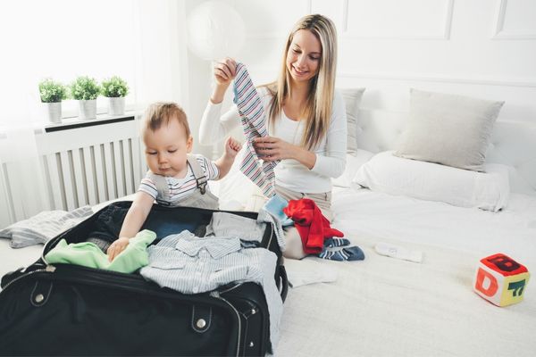 Toddler Helping Mum Pack For Travel