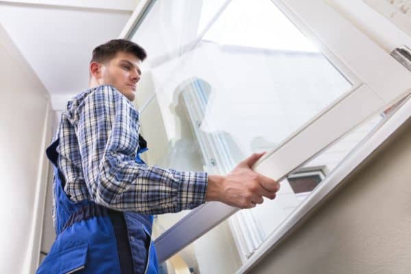 Window Repairman Removing Window