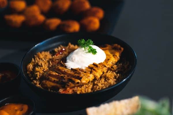 Black Plates And Bowls With Food