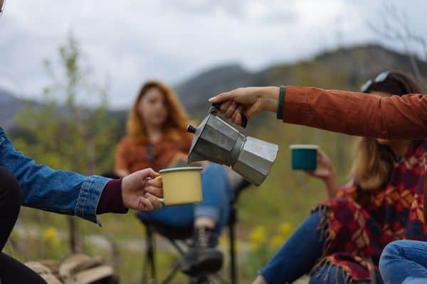 Camping Group Having Coffee In The Mountains