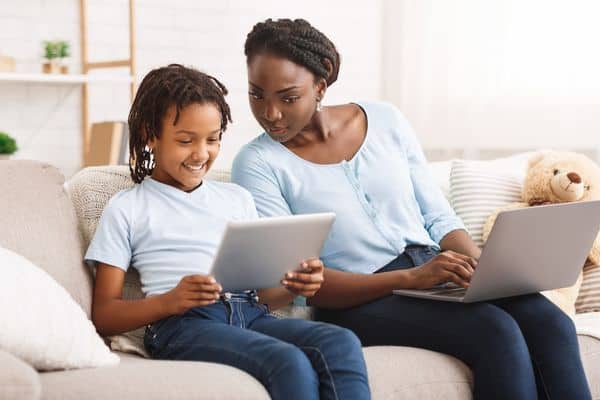 Mom Guiding Child To Safe Browsing Online