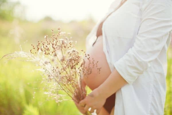 Pregnant Mum Holding Flowers