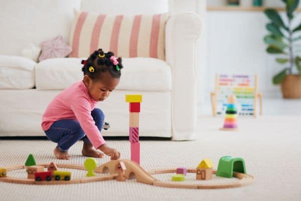Child Playing Wooden Block Train