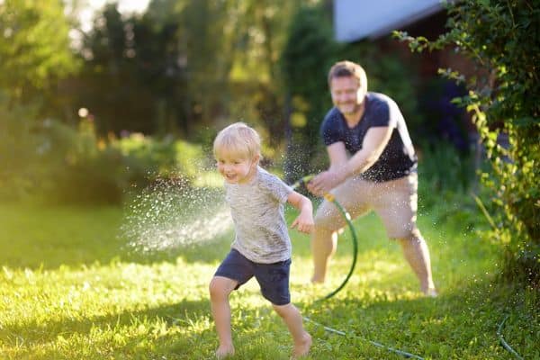 Family Playing In The Garden