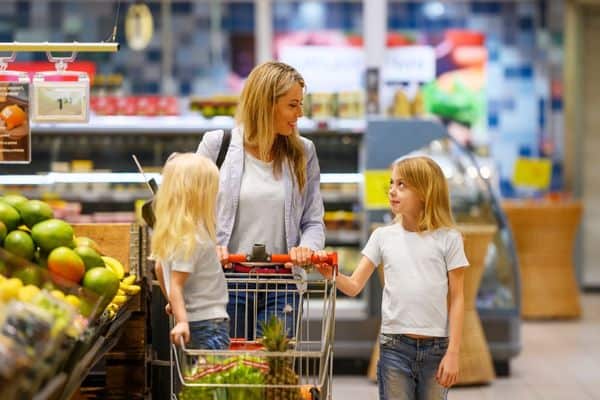 Mother And Children Buying Healthy Foods