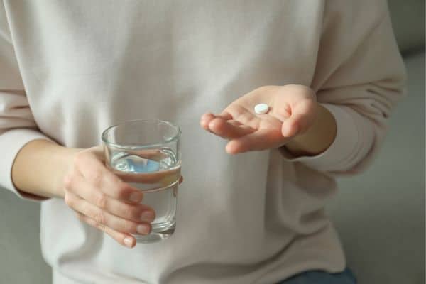 Person Drinking Medications