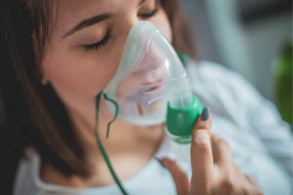 Woman Using A Respiratory Product