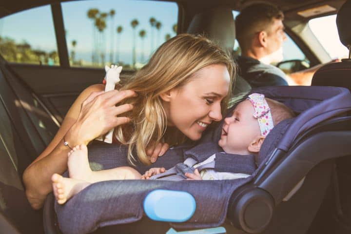 Woman With Baby In A Car