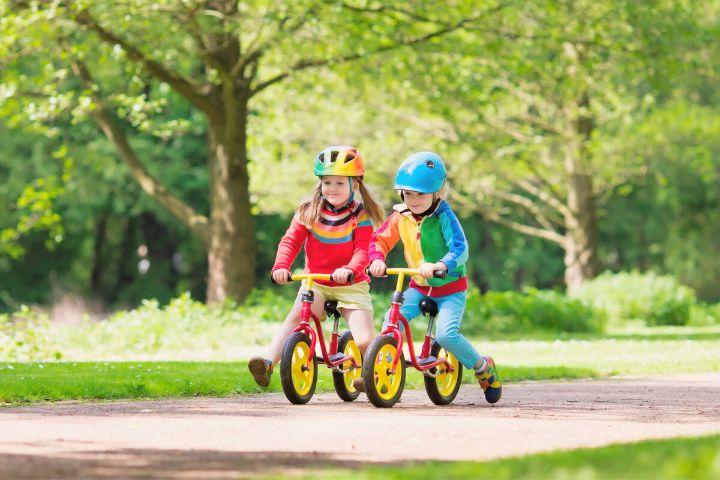 Two Girls Ride Bikes