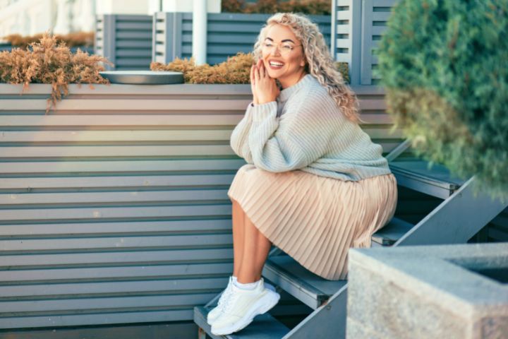 Woman In Knit Sweater And A Line Skirt