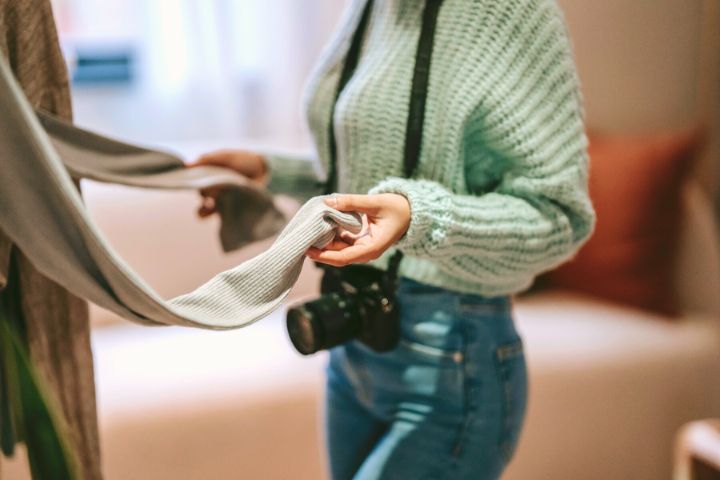 Woman In Knit Sweater And Jeans