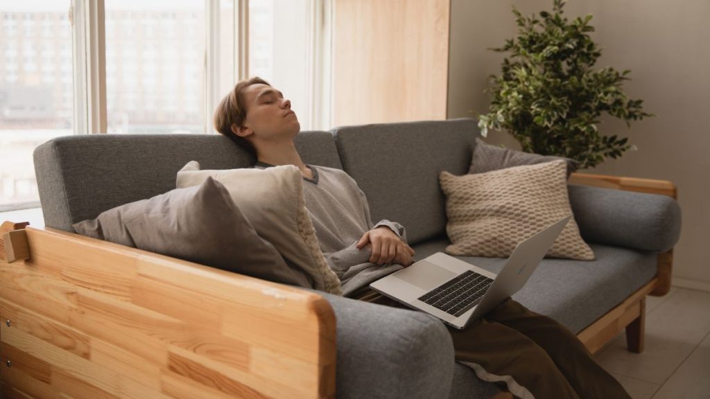 Person Sitting On Sofa