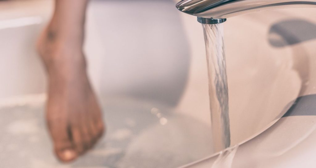 stepping into the bath