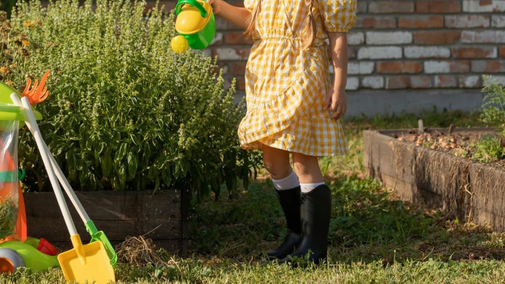 Child In Boots Playing