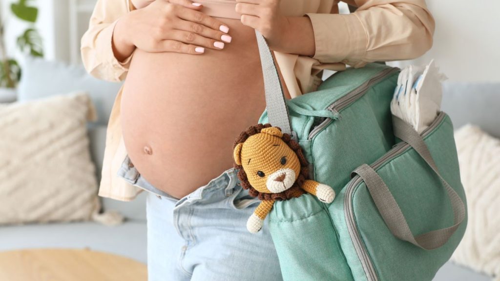 Pregnant Mum Carrying Maternity Bag